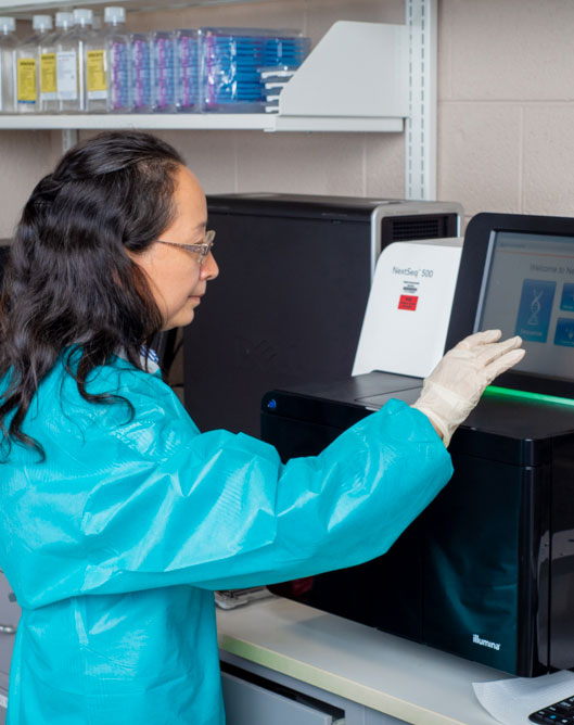 Scientist in lab using computer